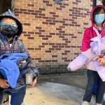 Photo courtesy of Ruth Pérez
Children collect coats from Operation Warm at Renton High School on Oct. 22.