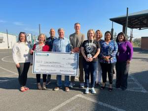 Courtesy Photo
Bob Hodges, Jerry Belur and Ed Barker with Lakeridge staff. Photo courtesy of the Renton Schools Foundation