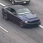 The suspect is still at large, last seen driving this dark blue Ford Mustang convertible with white writing on the lower portion of the windshield. Photo courtesy of Washington State Patrol.