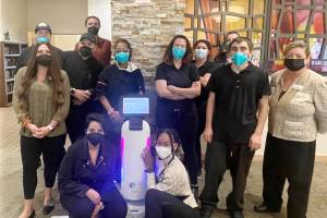 Dubbed R2D2, the Segway Servebot S1 picks up orders and delivers them to tables and even helps with bussing, allowing the GenCare staff more time to interact with residents. Photo courtesy GenCare Lifestyle