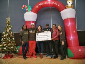 The UPS Foundation Esther Ndichu, Black Equality Coalition Anthony Curtis, UPS Community Relations Kate Kane, Community Passageways Dominque Davis and Andrea Altheimer, and UPSs Chief Corporate Affairs and Sustainability Officer Laura Lane. Photo courtesy of Black Equality Coalition.
