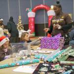 Photo courtesy of Black Equality Coalition.
Volunteers help during the gift-wrapping event.