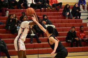 Renton Jr. Ajayi Simmons takes a jump-shot over a Newport defender. Ben Ray/The Reporter