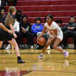 Senior Kimarah Crockett with the crossover for the Redhawks against Foster en route to a victory. Ben Ray / The Reporter