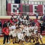 Renton boys pose with the student section after their KingCo championship victory. Ben Ray / The Reporter