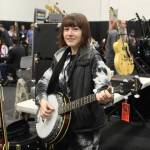 Arielle Munn, 31, of Tacoma has been playing guitar since she was 14 but gives the banjo a chance at the guitar show. Photo by Bailey Jo Josie/Sound Publishing
