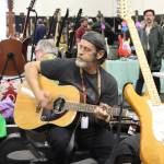 One vendor takes a break to play some music. Photo by Bailey Jo Josie/Sound Publishing