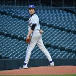 Hazen starting pitcher Sam Nicholson takes a look at the runner on first base. Ben Ray / The Reporter.