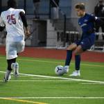 Senior Agustin Pernet makes a move on a Rainier Beach defender. Ben Ray / The Reporter