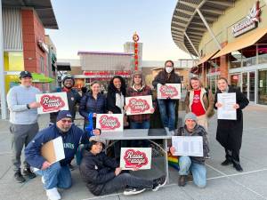 A group of volunteers gathering signatures at the Landing Shopping Centre. Photo courtesy of Raise the Wage Renton
