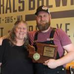 Four Generals co-owners and mother and son Mary Hudspeth and Ross Hudspeth pose with their Small Brewery of the Year plaque. Bailey Jo Josie / Renton Reporter