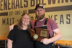 Four Generals co-owners and mother and son Mary Hudspeth and Ross Hudspeth pose with their Small Brewery of the Year plaque. Bailey Jo Josie / Renton Reporter