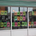 Common Ground Coffee and Cupcakes put encouraging words for the runners in their window. Bailey Jo Josie / Renton Reporter.