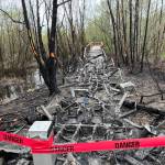 Damage to the Springbrook Trail boardwalk and the surrounding vegetation and environment resulted from a fire on April 15.(Courtesy of Randy Corman)