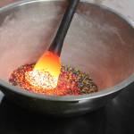 After taking the glass from the furnace, Bob Mays adds dimension and colors before putting the molten glass into the glory hole. Photo by Bailey Jo Josie/Sound Publishing.