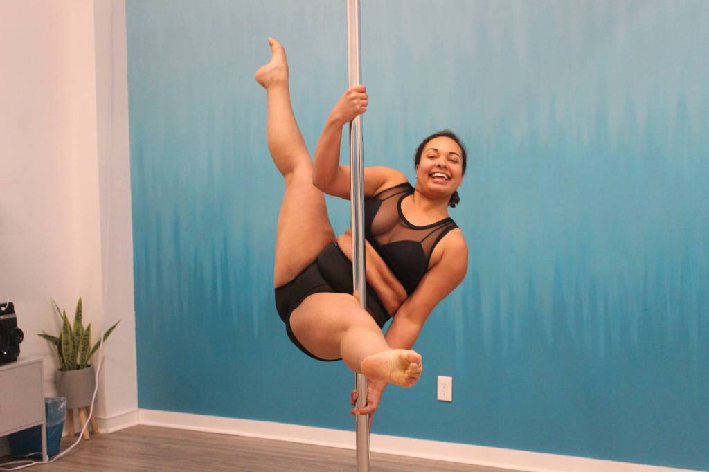 JoJo Clarke shows off the Apprentice pose on the pole. Photo by Bailey Jo Josie/Sound Publishing.
