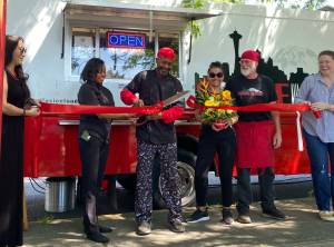The Soul Fusion food truck is now officially open for business. The down home soul food experience is now available wherever in Renton the truck may be parked. For the trucks ribbon cutting ceremony on Friday, June 23, the top-selling item on the menu was the Catfish Sandwich Combo, which Renton Reporters advertising representative Sianna Foster reports was sould out before she even arrived to the ceremony. Foster had the Fusion Burger, which she says was so good I couldnt stop eating it even though my body begged me to stop. Visit soulfusionfood.com to learn where the truck will be next. (Photo by Sianna Foster/Renton Reporter)