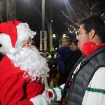 Photo by Bailey Jo Josie/Sound Publishing
Santa Claus stopped to shake hands with Renton High School student Lorenzo Armstrong-Jackson who was given a small bell to help signal St. Nicks arrival.