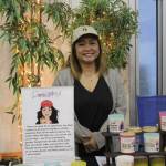 Divina of Depress Me Not Candles is all smiles during Renton's Small Business Saturday. Photo by Bailey Jo Josie/Sound Publishing.