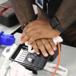 A Bryn Mawr staff member practices putting pressure on a wound model. Photo by Bailey Jo Josie/Sound Publishing.