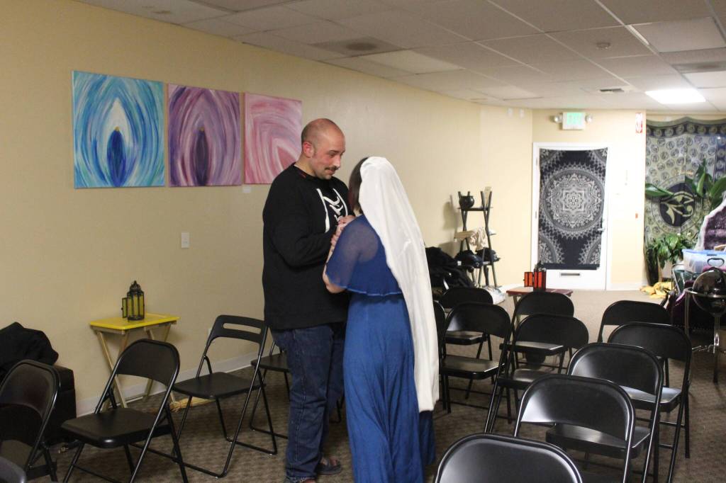 Noah Tassie and Julia Sayn rehearse their dance for the Yule skit they will perform during the ritual. "It's very spiritually welcoming," Tassie said of Triple Goddess Coven. Photo by Bailey Jo Josie/Sound Publishing.