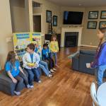 Photo courtesy of Julia Fishler
A Rockin Robot member helps coach the Yellow Giraffes on their presentation for the state championship.