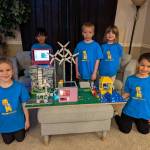 Photo courtesy of Julia Fishler
The Yellow Giraffes pose with their LEGO model.