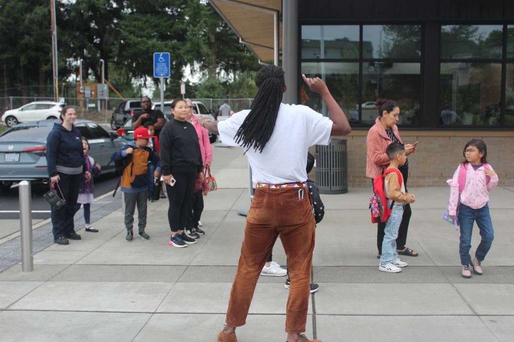 Kindergarten teacher Alexander Mkandawire directs students to the cafeteria on the first day of school. Photo by Bailey Jo Josie/Sound Publishing.