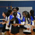 Highlanders celebrate after winning a point in the second set. Ben Ray / The Reporter
