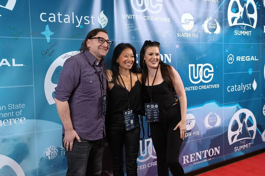 Cast and crew of Three Houses Down - a Christmas horror short about a murderous elf - pose for photos at The Summit. Photo by Bailey Jo Josie/Sound Publishing.