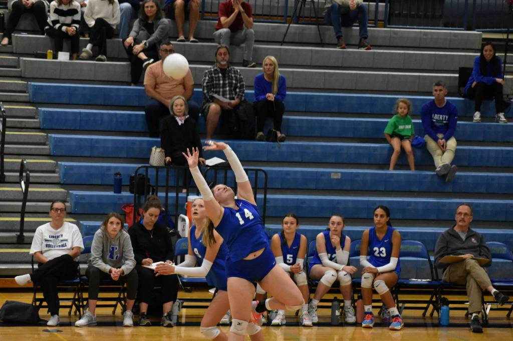 Senior Aimee Brester with a set early in the match against the Interlake Saints. Ben Ray / The Reporter