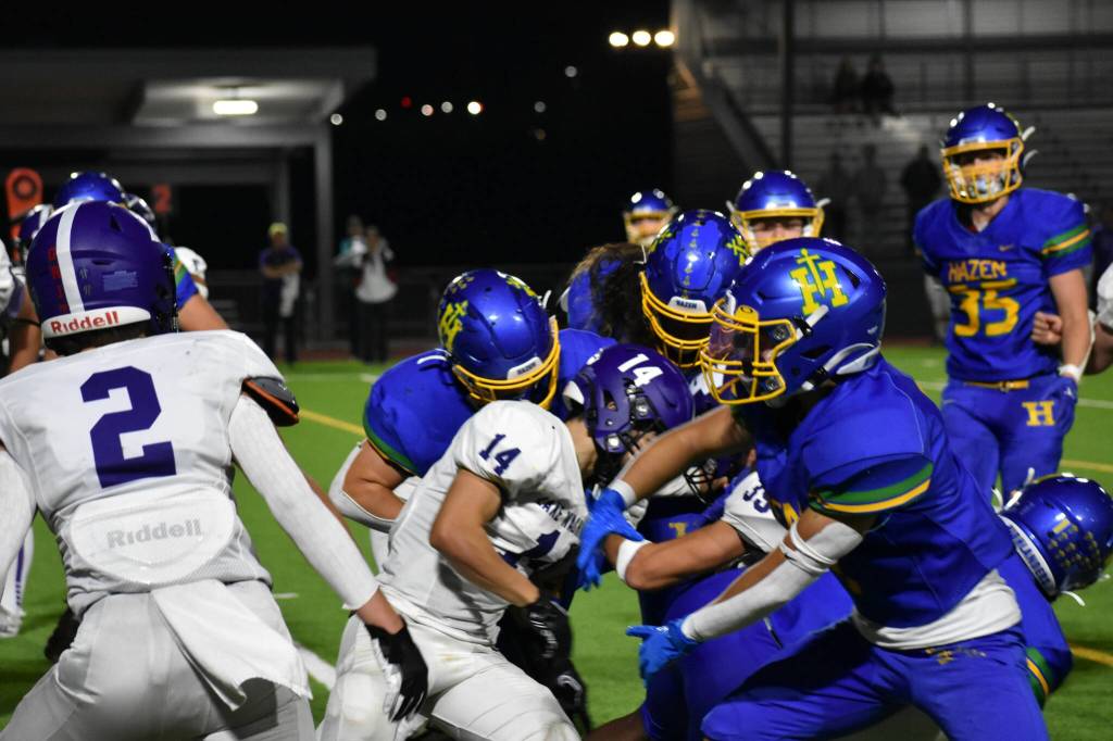 The Hazen offensive unit tries to push aside a Lake Washington defender. Ben Ray / The Reporter