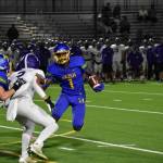 Senior Devaughn Daniels tries to avoid aa Kang tackler. Ben Ray / The Reporter