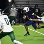 Abdul Gilbert shakes off a defender on his way to the end zone. Ben Ray / The Reporter