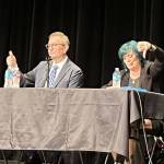 Renton Mayor Armondo Pavone, left, and challenger Kim Monroe Bass at the Renton candidates forum held Sept. 19 at the Carco Theatre. Candidates for council positions 3, 4, 5 and 7 also answered questions about local issues from moderator Diane Dobson of the Renton Chamber of Commerce. (Renton Reporter photo)