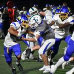 Isaac Rose tries to break a tackle against Liberty. Ben Ray / The Reporter