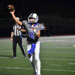 Freshman quarterback Tyson Burley makes a pass in the second quarter. Ben Ray / The Reporter
