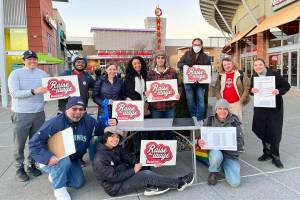 A group of volunteers gathering signatures at the Landing Shopping Centre. (Photo courtesy of Raise the Wage Renton)
