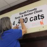 Bailey Jo Josie/Renton Reporter
Sally Halela updates the clinic sign to reflect the number of spay and neuter services to cats since August 2020.