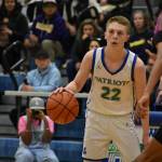 Jackson Whitaker engages with a Bellevue defender. Ben Ray / The Reporter