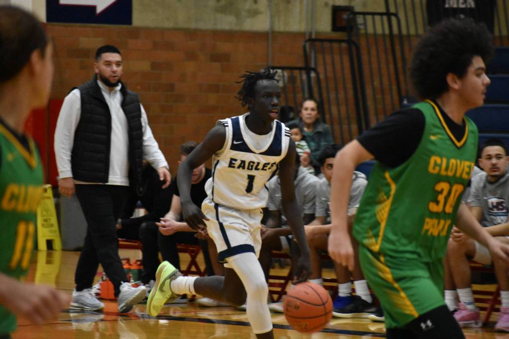 John Choul takes the ball up the floor for the Eagles. Ben Ray / The Reporter