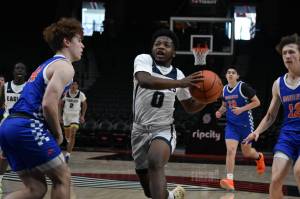 Duly Gilbert takes on a Mountainview defender. (Ben Ray / The Reporter)