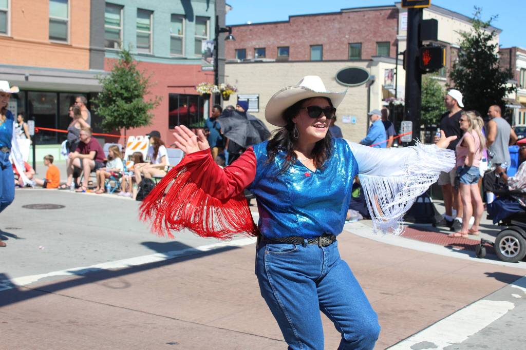 Line Dancers dazzle at the Renton River Days Parade.