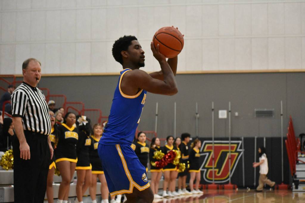 Vishon Antoine takes a three-pointer against Thomas Jefferson. Ben Ray / The Reporter