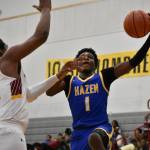Hazens Jaiden Damus goes to the hoop with a defender in his face. (Ben Ray / The Reporter)
