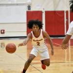 Junior Jordan Agosto makes a pass in the opening quarter against Rancho. Ben Ray / The Reporter