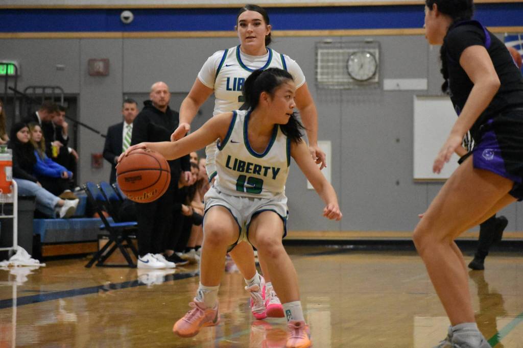 Addison Tran holds her dribble as help comes from her teammates in transition. Ben Ray / The Reporter