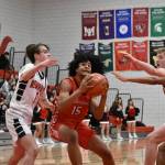 Freshman Micah Ili-Meneese finds himself surround by three Redhawk defenders. Ben Ray / The Reporter