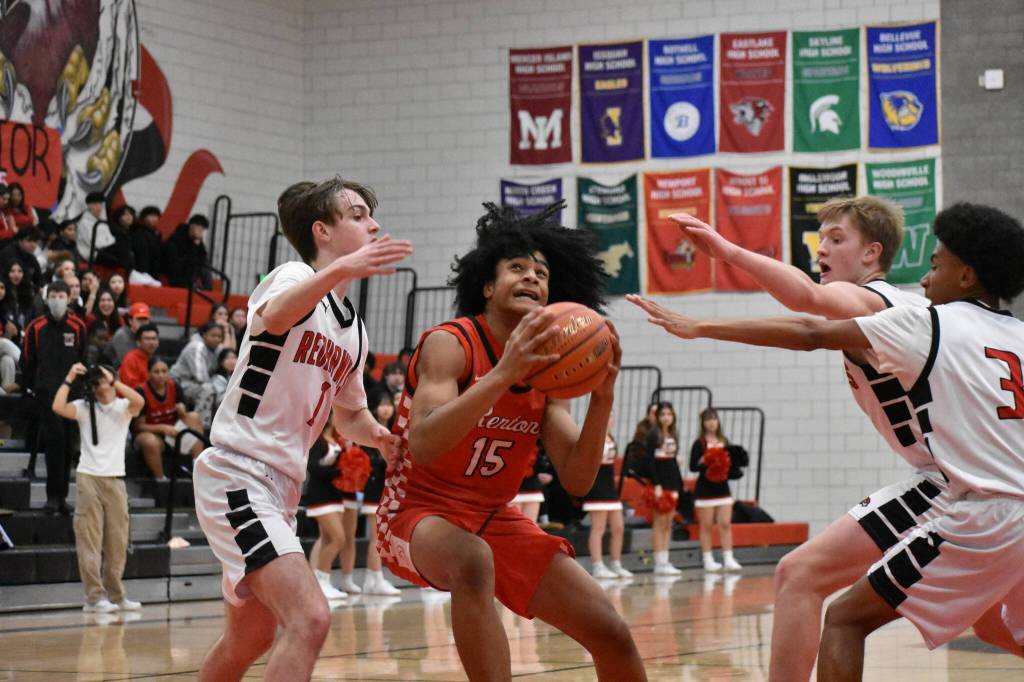 Freshman Micah Ili-Meneese finds himself surround by three Redhawk defenders. Ben Ray / The Reporter