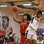 Ben Ray / The Reporter
Jordan Agosto goes up for a lay-up with the back of a Sammamish defender on his side.